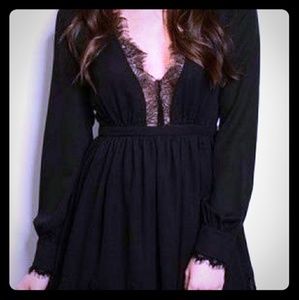 Gorgeous black lace trimmed lace-up mini dress